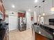 Kitchen boasts stainless steel appliances and granite countertops at 15239 Firelight Dr, Winter Garden, FL 34787