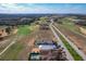 Aerial view of homes, golf course, and undeveloped land at 16324 Vetta Dr, Montverde, FL 34756