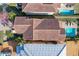 Aerial view of a house with a clay tile roof and a pool in the backyard at 16324 Vetta Dr, Montverde, FL 34756