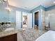 Double vanity bathroom with walk-in shower and tub at 16324 Vetta Dr, Montverde, FL 34756
