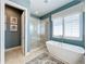Spa-like bathroom with soaking tub, walk-in shower, and modern fixtures at 16324 Vetta Dr, Montverde, FL 34756