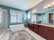 Spa-like bathroom with soaking tub and double vanity at 16324 Vetta Dr, Montverde, FL 34756