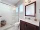 Bathroom with walk-in shower and modern vanity at 16324 Vetta Dr, Montverde, FL 34756