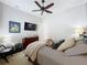 Spacious bedroom with large TV and comfortable bedding at 16324 Vetta Dr, Montverde, FL 34756