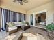 Relaxing covered patio with seating area, wicker furniture, and access to interior at 16324 Vetta Dr, Montverde, FL 34756