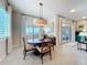 Charming dining area with wood table and chairs at 16324 Vetta Dr, Montverde, FL 34756