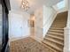 Spacious entryway with stairs, rug, and a view of the front door at 16324 Vetta Dr, Montverde, FL 34756