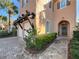 Two-story house with a two-car garage, walkway, and landscaping at 16324 Vetta Dr, Montverde, FL 34756