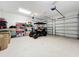 Spacious garage with golf cart and plenty of storage shelving at 16324 Vetta Dr, Montverde, FL 34756