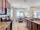 Kitchen boasts granite countertops and stainless steel appliances at 16324 Vetta Dr, Montverde, FL 34756