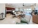 Open living room with kitchen, large sectional sofa, and pool view at 16324 Vetta Dr, Montverde, FL 34756