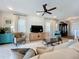 Bright living room with comfortable seating and large TV at 16324 Vetta Dr, Montverde, FL 34756