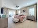 Main bedroom with king bed and access to balcony at 16324 Vetta Dr, Montverde, FL 34756