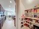 Well-organized pantry with ample shelving for storage at 16324 Vetta Dr, Montverde, FL 34756