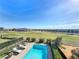 Luxury pool with expansive golf course views at 16324 Vetta Dr, Montverde, FL 34756