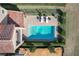 Aerial view of a refreshing blue pool, surrounded by a patio and lush landscaping at 16324 Vetta Dr, Montverde, FL 34756