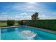 Enjoy this refreshing pool with water feature at 16324 Vetta Dr, Montverde, FL 34756