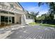 Spacious backyard featuring a large deck, pergola and lush landscaping at 2315 Depauw Ave, Orlando, FL 32804