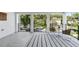 An open balcony overlooking the street with a table and two chairs at 2315 Depauw Ave, Orlando, FL 32804