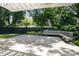 Backyard deck with pergola and bench overlooking a grassy area at 2315 Depauw Ave, Orlando, FL 32804