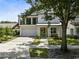 Modern two-story house with a green door and spacious driveway at 2315 Depauw Ave, Orlando, FL 32804