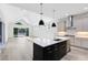 Spacious kitchen with an island, stainless steel appliances, and white cabinets at 2315 Depauw Ave, Orlando, FL 32804