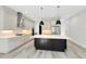 Open kitchen with an island and stainless steel appliances at 2315 Depauw Ave, Orlando, FL 32804