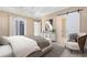 Spacious bedroom with modern decor, slider to balcony, and barn door to the en suite bathroom at 2315 Depauw Ave, Orlando, FL 32804