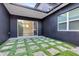 Back patio with artificial turf and gravel stones and sliding glass doors for easy access to the interior at 2315 Depauw Ave, Orlando, FL 32804