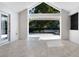Covered patio overlooking a large backyard and lush landscaping at 2315 Depauw Ave, Orlando, FL 32804