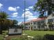 Princeton Elementary School with well-maintained lawn, palm trees and blue skies on a beautiful sunny day at 2315 Depauw Ave, Orlando, FL 32804