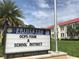 Princeton Elementary School sign highlighting OCPS, with the school building and palm trees in the background at 2315 Depauw Ave, Orlando, FL 32804