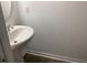 Clean bathroom with pedestal sink and updated fixtures at 2407 Zuni Rd, St Cloud, FL 34771