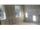 Unfinished bedroom with windows and unpainted walls at 2437 Zuni Rd, St Cloud, FL 34771