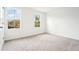 Bright and airy bedroom with neutral carpet and two windows at 2437 Zuni Rd, St Cloud, FL 34771