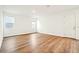 Bright, airy bedroom showcasing neutral walls and wood flooring, ready for personalization at 2437 Zuni Rd, St Cloud, FL 34771