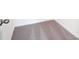 Close up of a carpeted floor with white trim and a door with a silver knob at 2437 Zuni Rd, St Cloud, FL 34771