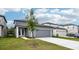 Beautiful new construction home with a two car garage and well maintained lawn at 2437 Zuni Rd, St Cloud, FL 34771