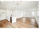 Spacious living room featuring an open floor plan, wood floors, recessed lighting, and modern finishes at 2437 Zuni Rd, St Cloud, FL 34771
