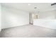Bright and spacious loft or bonus room with neutral carpet and ample natural light from windows at 2437 Zuni Rd, St Cloud, FL 34771