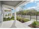 View from the porch looking out to the street, showcasing the community's manicured landscaping and sidewalk at 2437 Zuni Rd, St Cloud, FL 34771