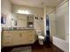 Bathroom with a beige vanity and a bathtub at 3208 Oyster Ln, Kissimmee, FL 34747