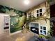 Themed bedroom with Lion King mural and built-in bunk beds at 3208 Oyster Ln, Kissimmee, FL 34747