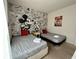 Bedroom with twin beds and a Mickey Mouse theme at 3208 Oyster Ln, Kissimmee, FL 34747