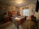 Bedroom with a wooden bed frame and dark wood furniture at 3208 Oyster Ln, Kissimmee, FL 34747