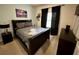 Bedroom with a dark wood bed frame and Star Wars decor at 3208 Oyster Ln, Kissimmee, FL 34747