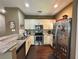 Galley kitchen with granite countertops and stainless steel appliances at 3208 Oyster Ln, Kissimmee, FL 34747
