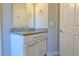 Bathroom vanity with granite countertop and white cabinets at 3667 Kingswood Ct, Clermont, FL 34711