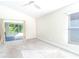 Bright bedroom with grey carpet, sliding glass door to patio, and ceiling fan at 3667 Kingswood Ct, Clermont, FL 34711