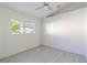 Bright bedroom with large window and ceiling fan at 3667 Kingswood Ct, Clermont, FL 34711